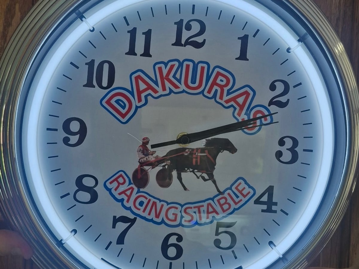 Custom racing stable neon clock with purple glow